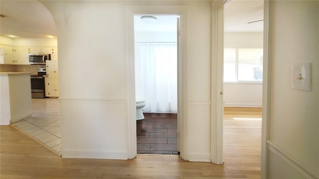 hall with light wood-type flooring