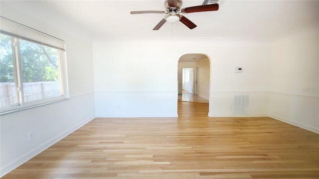 empty room featuring ceiling fan and light hardwood / wood-style flooring