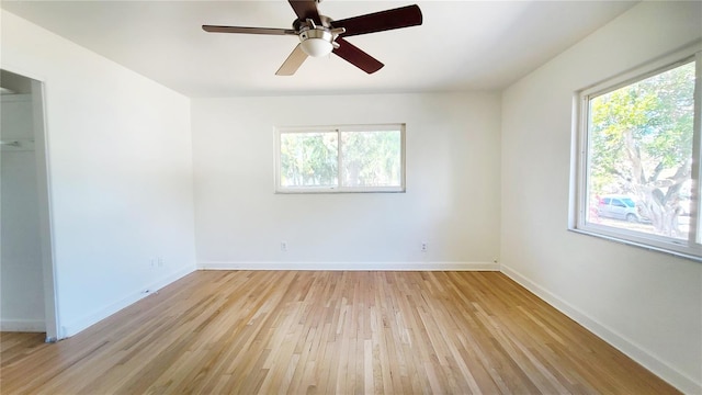 spare room featuring ceiling fan and light wood-type flooring