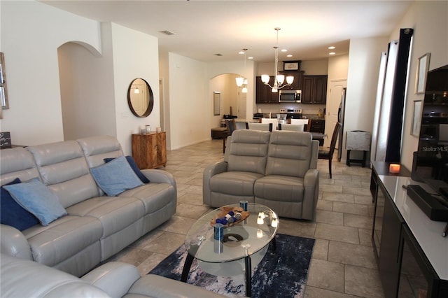 living room featuring an inviting chandelier