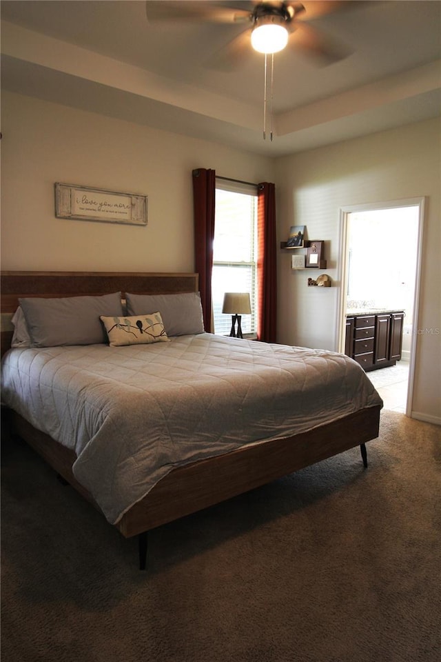 bedroom featuring light colored carpet and ceiling fan