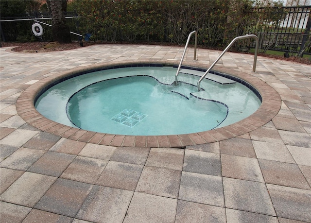 view of pool featuring a community hot tub