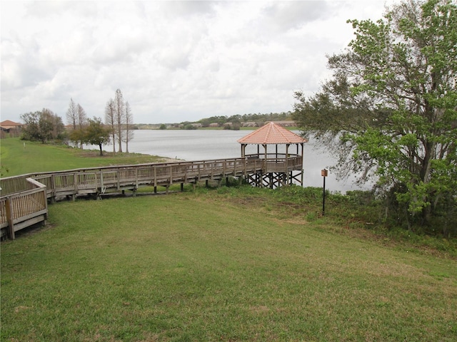 view of yard featuring a gazebo and a water view