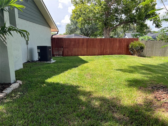 view of yard featuring central air condition unit