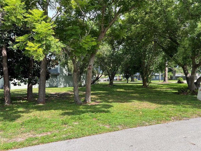 view of property's community with a lawn