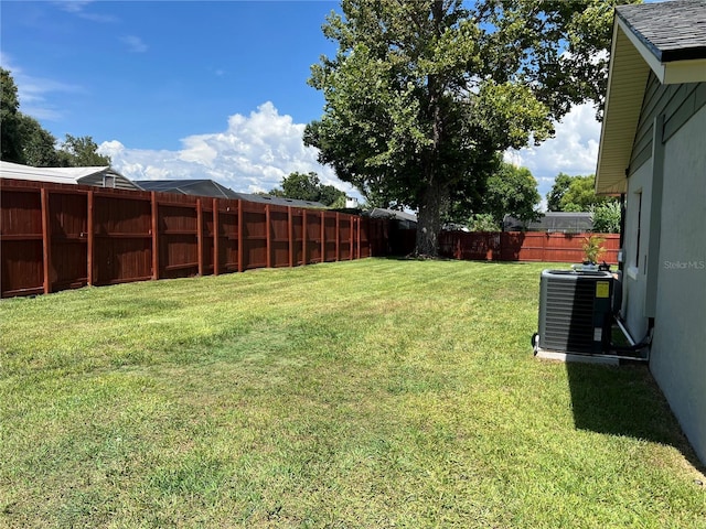 view of yard with central AC