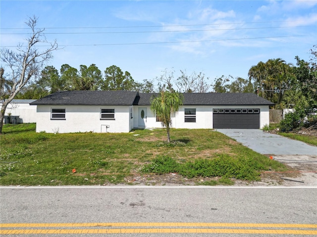 view of front of house featuring a garage and a front yard