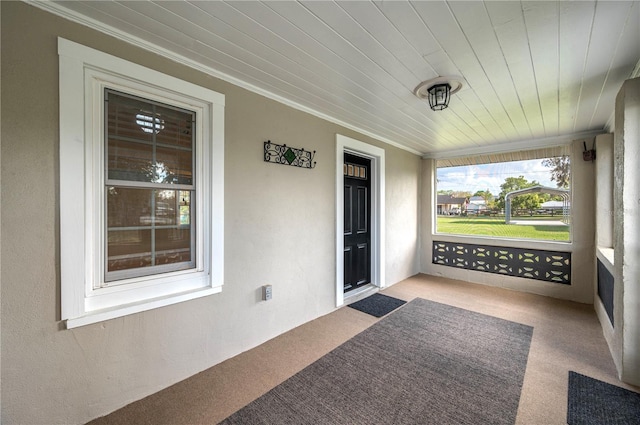 sunroom with wooden ceiling