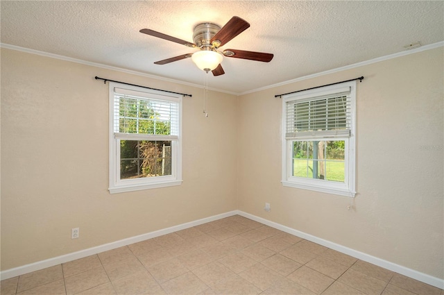 spare room with ornamental molding and baseboards