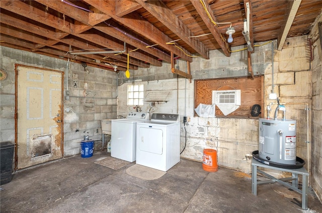 below grade area with separate washer and dryer, electric water heater, and concrete block wall