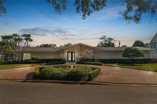 single story home featuring french doors