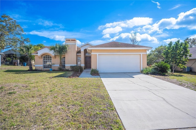 view of front of property with a garage, a front lawn, and central air condition unit