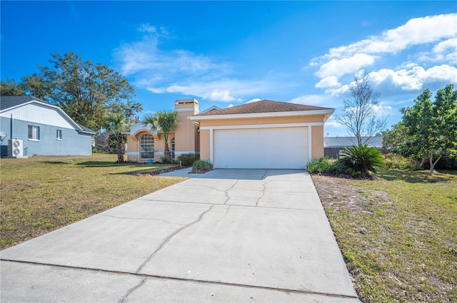 view of front of home with a garage and a front lawn