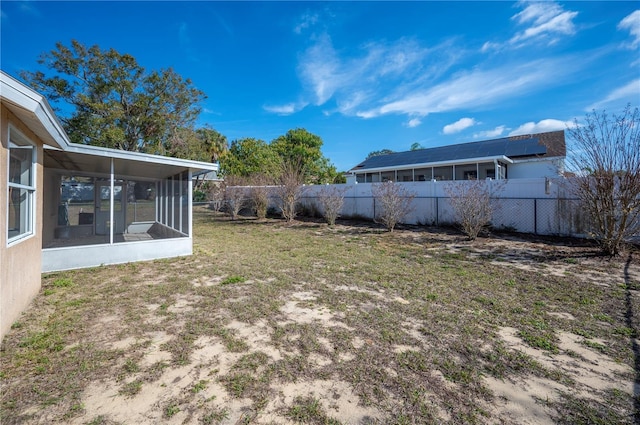 view of yard with a sunroom