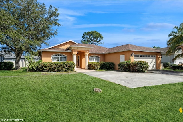 single story home with a garage and a front yard