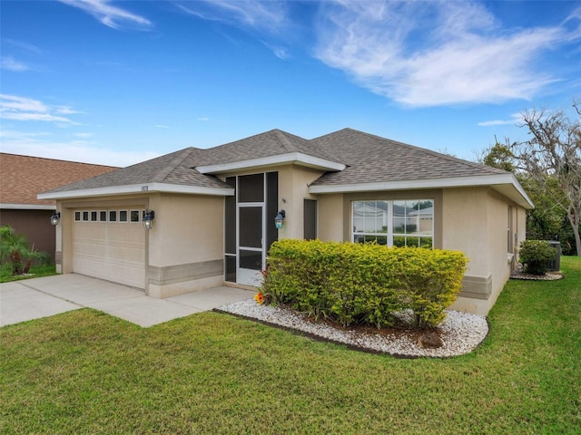 view of front of house with a garage and a front yard