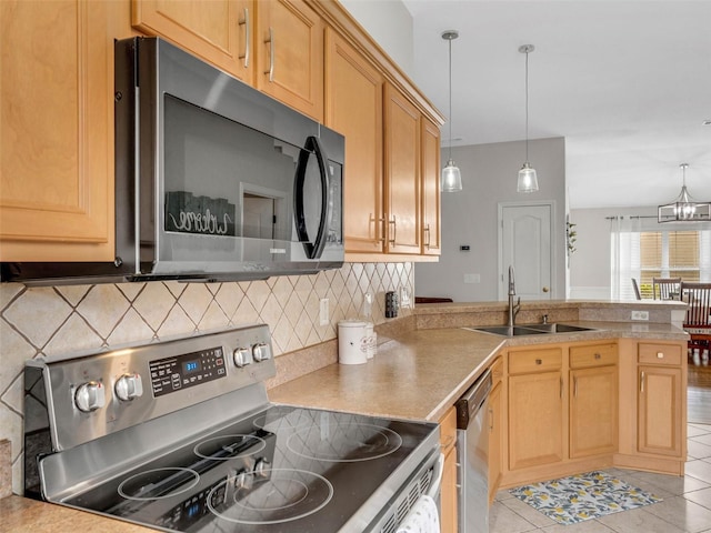 kitchen with sink, decorative backsplash, stainless steel appliances, and light tile patterned flooring