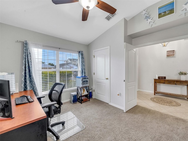 carpeted office space featuring vaulted ceiling and ceiling fan