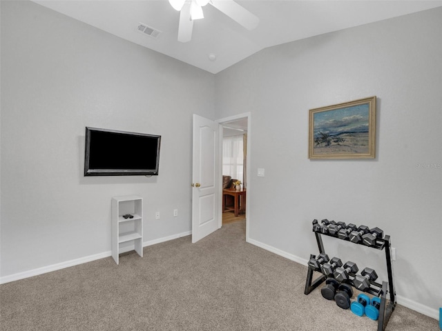 interior space featuring lofted ceiling, light colored carpet, and ceiling fan