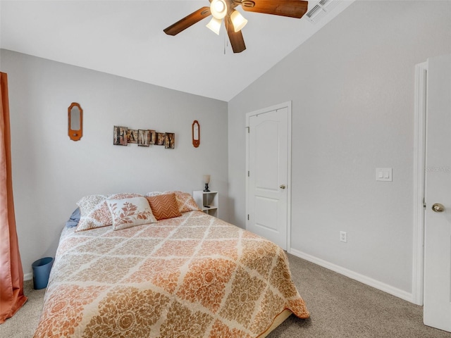 bedroom featuring vaulted ceiling, carpet floors, and ceiling fan