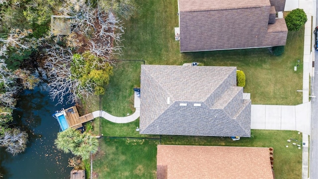 bird's eye view with a water view