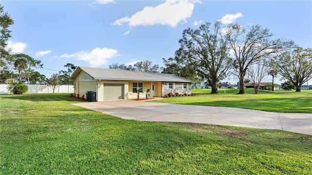 ranch-style house featuring a garage and a front yard