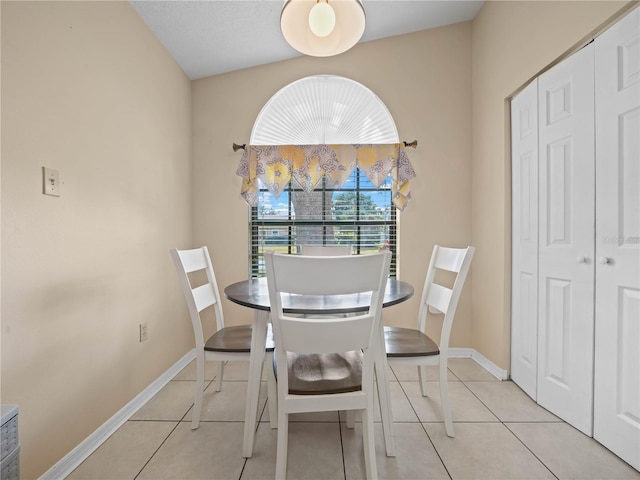 dining space with light tile patterned floors