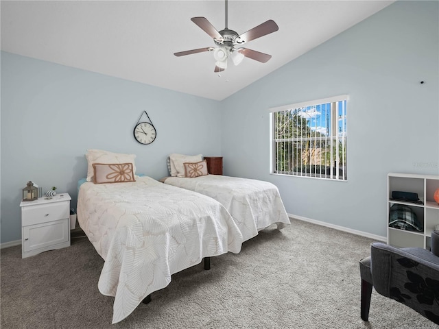 carpeted bedroom with vaulted ceiling and ceiling fan