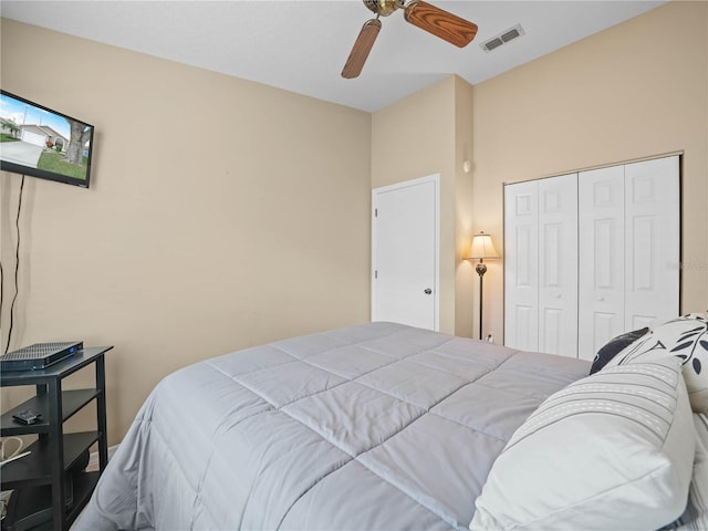 bedroom featuring ceiling fan and a closet