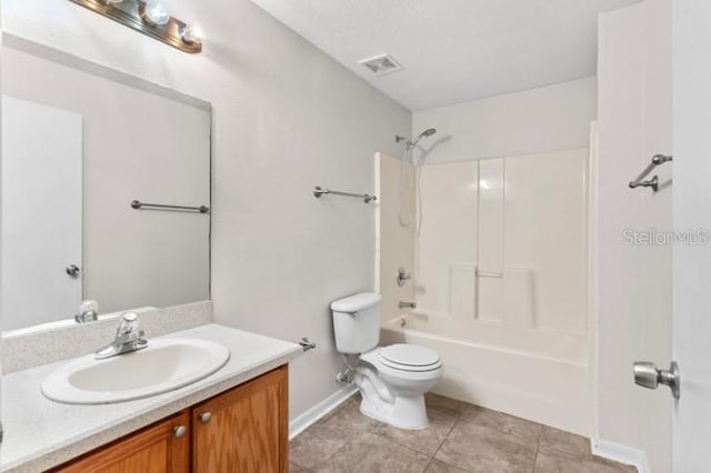 full bathroom with vanity, tile patterned flooring, toilet, and washtub / shower combination