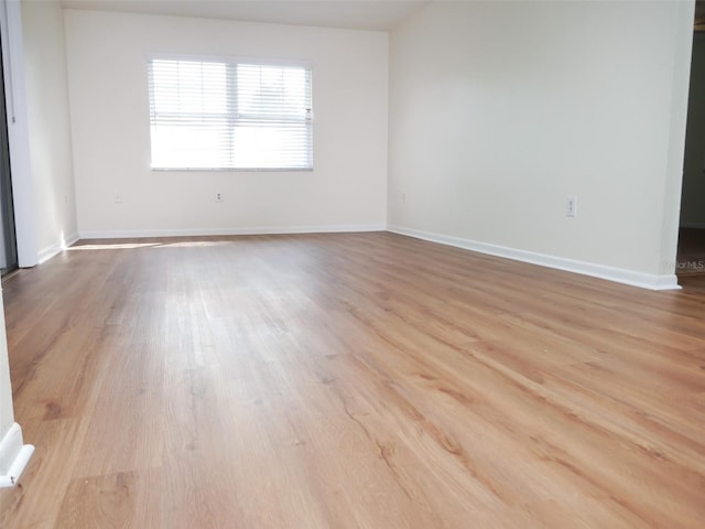 unfurnished room featuring light hardwood / wood-style floors