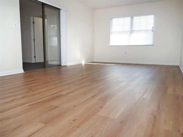 spare room with light hardwood / wood-style floors