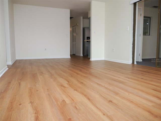 unfurnished living room featuring light hardwood / wood-style floors