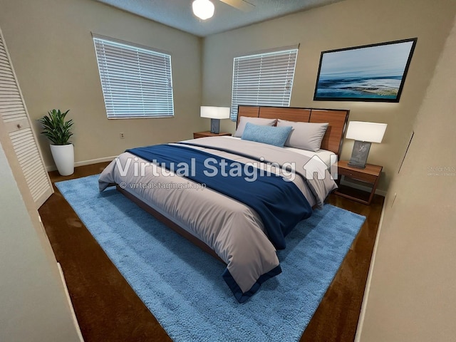 bedroom with dark hardwood / wood-style floors