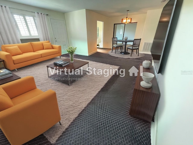 living room with carpet floors and a chandelier