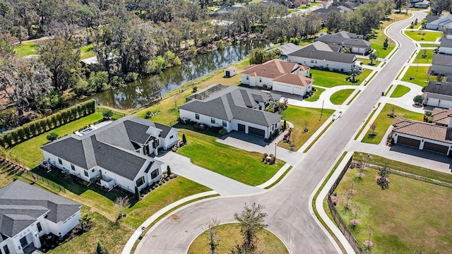 drone / aerial view with a water view