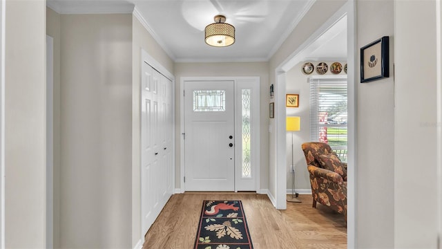 foyer entrance with crown molding and light wood-type flooring