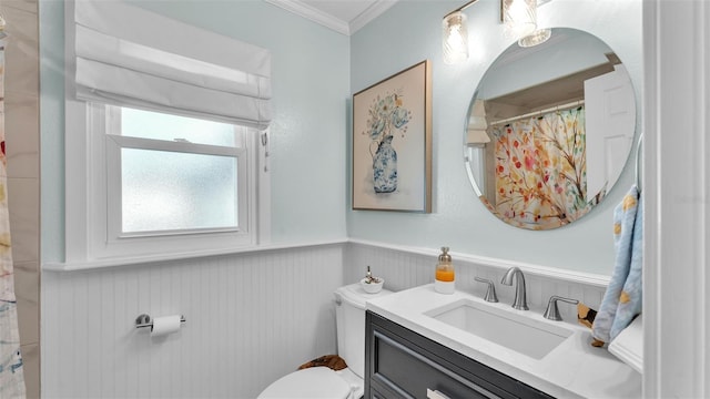 bathroom featuring vanity, ornamental molding, and toilet