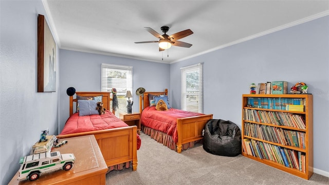 bedroom featuring ornamental molding, light colored carpet, and ceiling fan