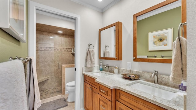 bathroom with toilet, vanity, crown molding, and walk in shower