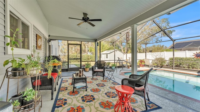 sunroom featuring vaulted ceiling