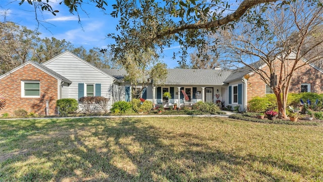 ranch-style house with a porch and a front yard