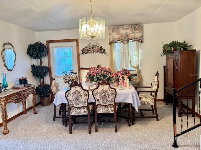 carpeted dining space featuring cooling unit and a chandelier