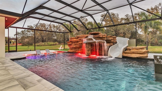 view of pool featuring a water slide and glass enclosure