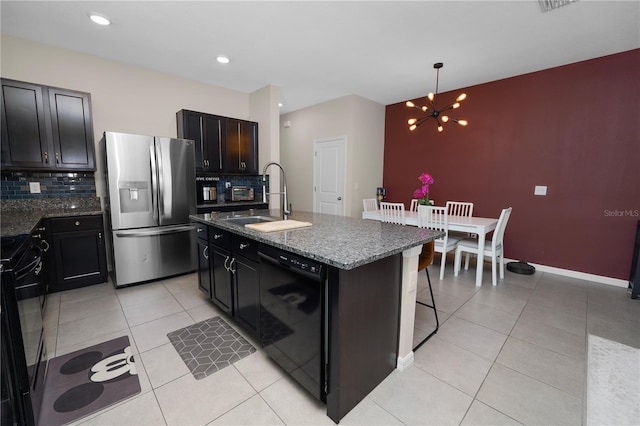 8680 Falling Blue Pl, Riverview, FL 33578 - kitchen with black appliances, a sink, backsplash, light tile patterned floors, and a chandelier