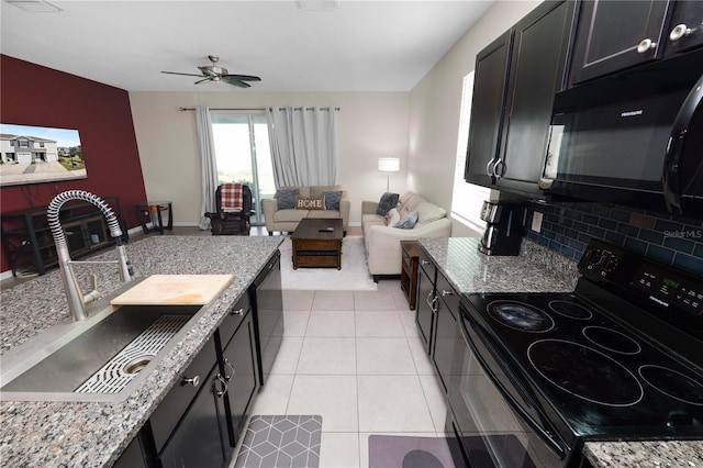 8680 Falling Blue Pl, Riverview, FL 33578 - kitchen with black appliances, a sink, a ceiling fan, backsplash, and dark cabinetry