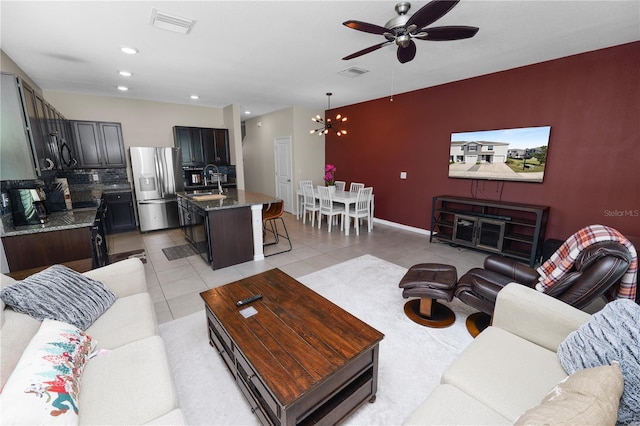 8680 Falling Blue Pl, Riverview, FL 33578 - living area featuring ceiling fan, light tile patterned floors, a chandelier, baseboards, and recessed lighting
