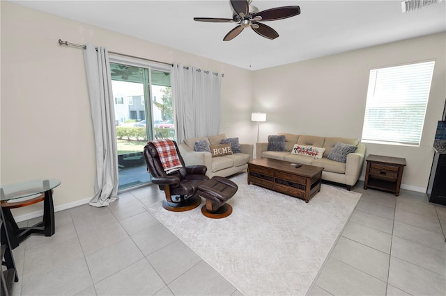 8680 Falling Blue Pl, Riverview, FL 33578 - living area with a ceiling fan, light tile patterned floors, and baseboards