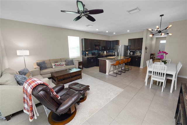 8680 Falling Blue Pl, Riverview, FL 33578 - living area featuring a chandelier, light tile patterned floors, a ceiling fan, and recessed lighting