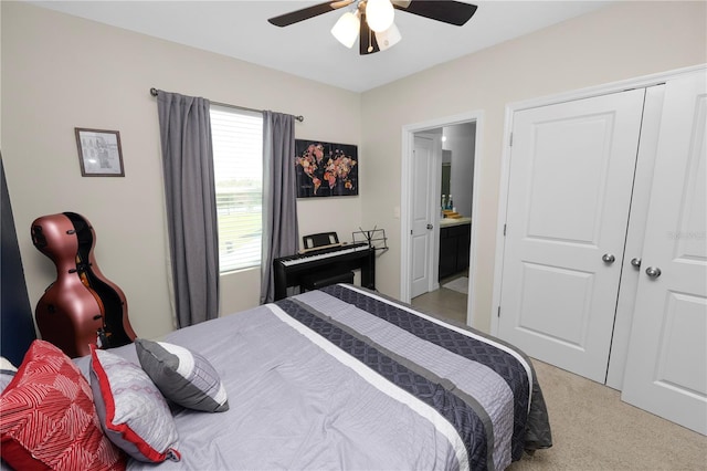8680 Falling Blue Pl, Riverview, FL 33578 - bedroom with light colored carpet, ensuite bathroom, and ceiling fan